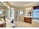 Elegant bathroom with double vanity, shower, and soaking tub at 8752 Monterey Bay Loop, Bradenton, FL 34212