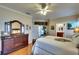 Main bedroom with dresser and access to the bathroom and patio at 8752 Monterey Bay Loop, Bradenton, FL 34212