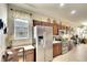 Modern kitchen featuring stainless steel appliances and a breakfast bar at 8752 Monterey Bay Loop, Bradenton, FL 34212