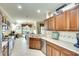 Eat-in kitchen with ample counter space and a view to the dining area at 8752 Monterey Bay Loop, Bradenton, FL 34212