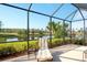 Relaxing screened patio overlooking a tranquil lake at 8752 Monterey Bay Loop, Bradenton, FL 34212