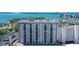 Aerial view of a modern high rise building with water and city views at 101 S Gulfstream Ave # 8G, Sarasota, FL 34236
