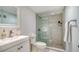 Updated bathroom with a walk-in shower and white vanity at 101 S Gulfstream Ave # 8G, Sarasota, FL 34236