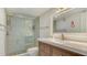 Modern bathroom with a walk-in shower and a wood vanity at 101 S Gulfstream Ave # 8G, Sarasota, FL 34236