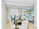Community game room with a chessboard, seating area, and pool view at 101 S Gulfstream Ave # 8G, Sarasota, FL 34236