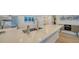 Sleek kitchen with white cabinetry, stainless steel appliances, and a large island at 101 S Gulfstream Ave # 8G, Sarasota, FL 34236