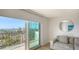 Living room with sliding doors leading to a balcony with water views at 101 S Gulfstream Ave # 8G, Sarasota, FL 34236