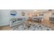 Spacious living room features a sofa and a large TV at 101 S Gulfstream Ave # 8G, Sarasota, FL 34236