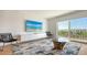 Living area with large TV, comfortable seating, and hardwood floors at 101 S Gulfstream Ave # 8G, Sarasota, FL 34236