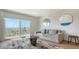 Living room features a comfortable sofa, large windows and water views at 101 S Gulfstream Ave # 8G, Sarasota, FL 34236