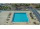 Aerial view of a condo building pool and deck area with lounge chairs and tables at 101 S Gulfstream Ave # 8G, Sarasota, FL 34236