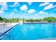 Refreshing swimming pool with surrounding lounge chairs and a scenic view at 101 S Gulfstream Ave # 8G, Sarasota, FL 34236