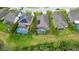 Aerial view of homes with solar panels and pools at 10515 52Nd E Ct, Parrish, FL 34219