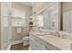 Double vanity bathroom with marble countertop at 10619 Restoration Ter, Bradenton, FL 34212