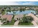 Aerial view of a luxurious house nestled in a waterfront community at 115 Grand Oak Cir, Venice, FL 34292
