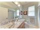 Bathroom with granite countertop and single sink vanity at 115 Grand Oak Cir, Venice, FL 34292