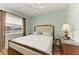 Guest bedroom with wood flooring and large window at 115 Grand Oak Cir, Venice, FL 34292