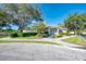 Community center with welcoming entrance and landscaping at 115 Grand Oak Cir, Venice, FL 34292