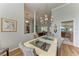 Spacious dining area with a view into the living room and kitchen at 115 Grand Oak Cir, Venice, FL 34292