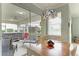 Breakfast nook with access to a screened patio and hot tub at 115 Grand Oak Cir, Venice, FL 34292