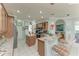 Kitchen boasts granite counters, wood cabinets & island at 115 Grand Oak Cir, Venice, FL 34292