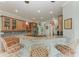 Modern kitchen with granite countertops and wood cabinets at 115 Grand Oak Cir, Venice, FL 34292
