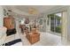 Open concept living area with access to the kitchen and backyard at 115 Grand Oak Cir, Venice, FL 34292