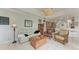 Open living space with a view into the kitchen and access to the backyard at 115 Grand Oak Cir, Venice, FL 34292