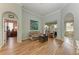 Spacious living area with hardwood floors and access to a patio at 115 Grand Oak Cir, Venice, FL 34292