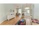 Bright living area with hardwood floors, showcasing a dining area and entryway at 115 Grand Oak Cir, Venice, FL 34292