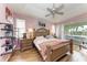 Large main bedroom with a king-size bed, walk-in closet, and private access to the patio at 115 Grand Oak Cir, Venice, FL 34292