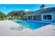 Inviting community pool with adjacent clubhouse at 115 Grand Oak Cir, Venice, FL 34292