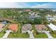 Aerial perspective of houses in a residential community near a road at 120 Grand Oak Cir, Venice, FL 34292