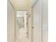 Hallway with access to bathroom and closets at 120 Grand Oak Cir, Venice, FL 34292