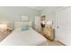 Guest bedroom with full-size bed and adjacent living area at 120 Grand Oak Cir, Venice, FL 34292