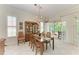 Elegant dining room with a wood table and access to a lanai at 120 Grand Oak Cir, Venice, FL 34292