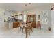 Bright dining room features a chandelier and wood furnishings at 120 Grand Oak Cir, Venice, FL 34292