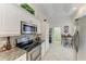 Updated kitchen features stainless steel appliances and granite counters at 120 Grand Oak Cir, Venice, FL 34292