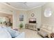 Spacious living room with hardwood floors, a large TV, and ample seating at 120 Grand Oak Cir, Venice, FL 34292