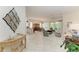 Open living space with tile floors, neutral tones, and access to the patio at 120 Grand Oak Cir, Venice, FL 34292