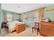 Cozy bedroom with ample natural light and wood dresser at 1211 45Th E Ave, Ellenton, FL 34222