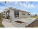Tan mobile home with a patio and landscaping at 1211 45Th E Ave, Ellenton, FL 34222