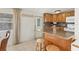 Kitchen features oak cabinets and a breakfast bar at 1211 45Th E Ave, Ellenton, FL 34222