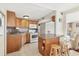 Well-equipped kitchen with oak cabinets and breakfast bar at 1211 45Th E Ave, Ellenton, FL 34222