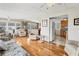 Open concept living room with kitchen view and hardwood floors at 1211 45Th E Ave, Ellenton, FL 34222