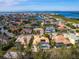 Aerial view of upscale waterfront community with numerous houses and canals at 12317 Baypointe Ter, Cortez, FL 34215