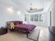 Spacious bedroom with king-size bed and access to private balcony at 12317 Baypointe Ter, Cortez, FL 34215