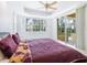 Bright bedroom with king-size bed and sliding doors to the patio at 12317 Baypointe Ter, Cortez, FL 34215