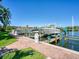Community boat docks with several boats and beautiful water views at 12317 Baypointe Ter, Cortez, FL 34215