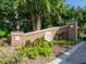 Landscaped entrance sign for Harbour Landings Estates, showcasing lush greenery at 12317 Baypointe Ter, Cortez, FL 34215